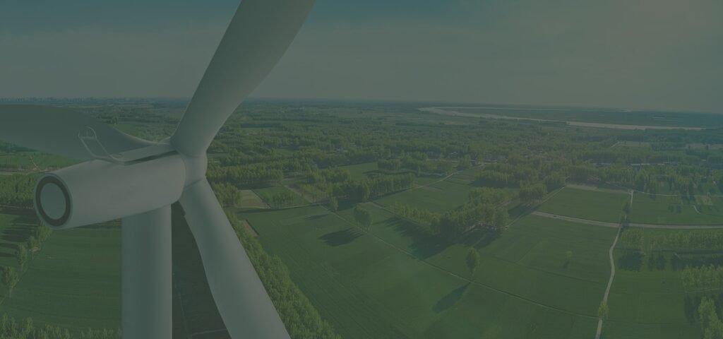 Wind turbine over green farmland